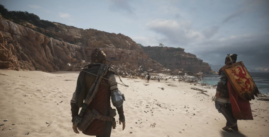 Два воина идут по пляжу у скал