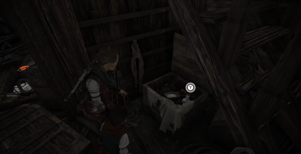 Амиция осматривает сундук в деревянном сарае A Plague Tale
