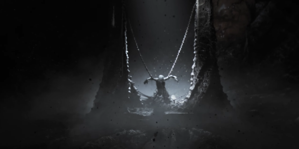 Фигура висит на цепях в тёмной пещере
