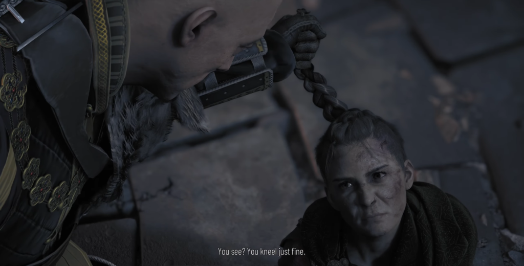 Мужчина держит женщину за косу на камнях