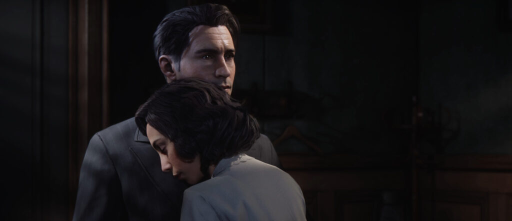 Мужчина обнимает женщину в темной комнате