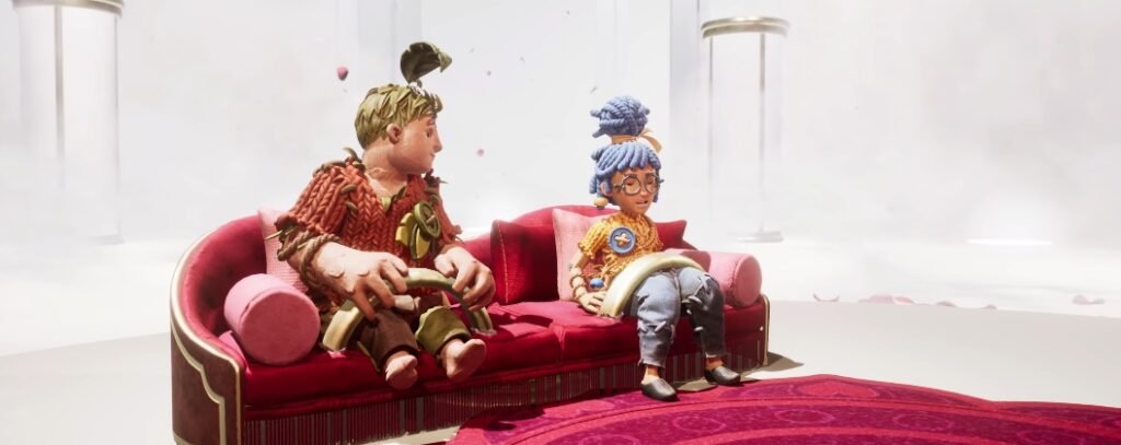 Мэй и Коди из It Takes Two сидят на красном диване